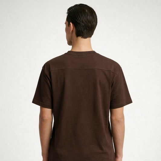 Person wearing a brown t-shirt on a white background